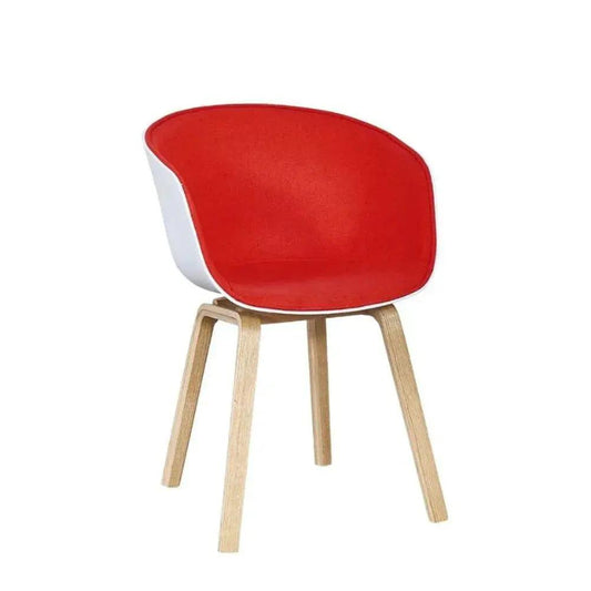 Chair with red cushioned seat and backrest on a white background