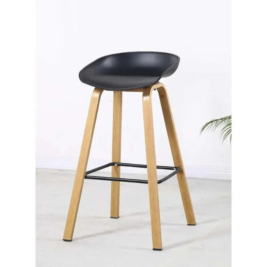 Bar stool with black seat and wooden legs on a white background