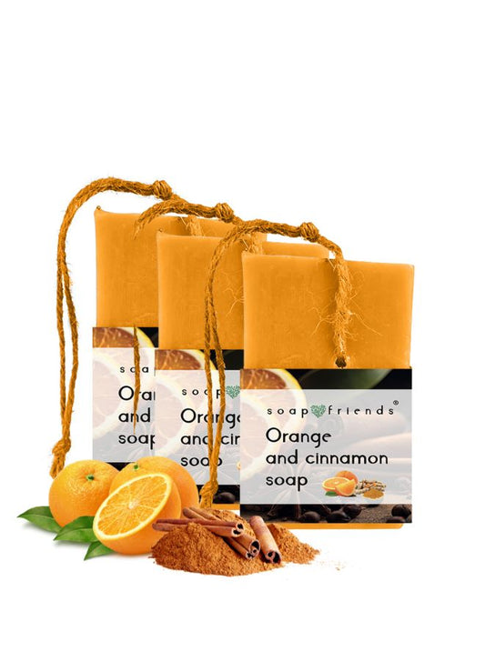 Three bars of soap with 'Orange and Cinnamon' scent, tied together with a rope, on a white background.