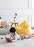 LUCKYSAC Classic Bean Bag with foot stool yellow in a room