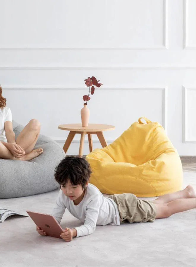 LUCKYSAC Classic Bean Bag with foot stool yellow in a room