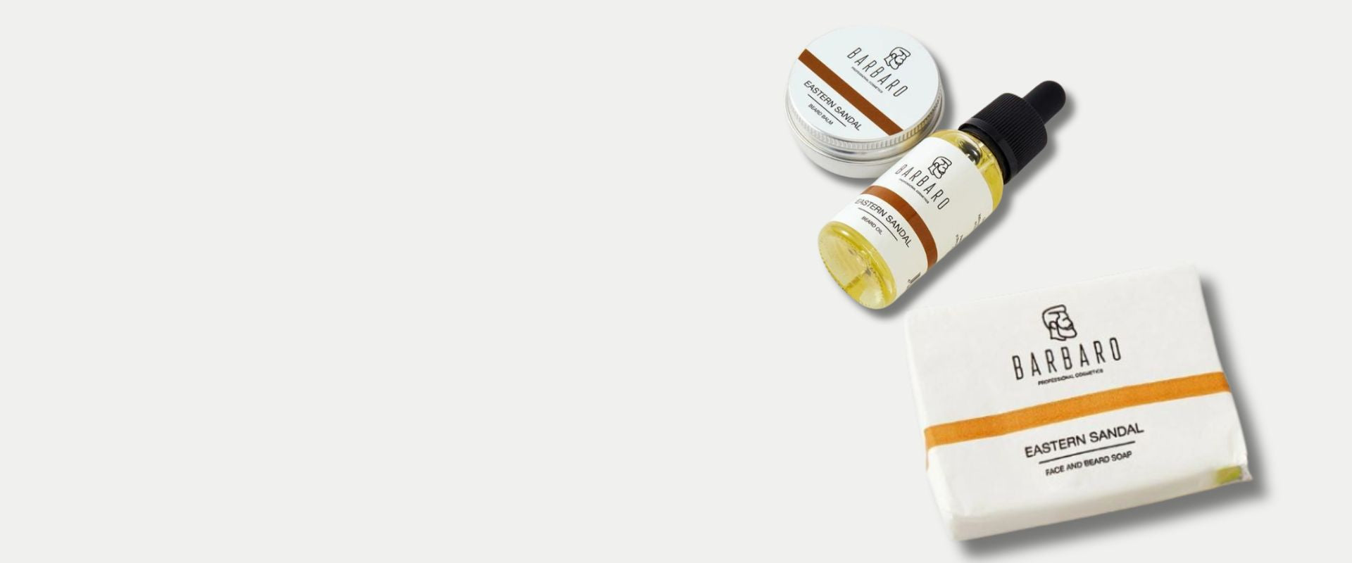 Barbaro products including a bottle, jar, and box on a light gray background