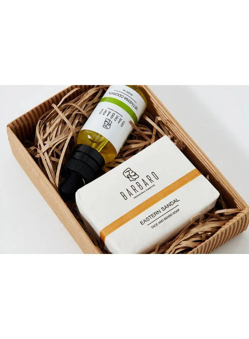 Barbaro soap and beard oil bottle in a wicker basket on a white background