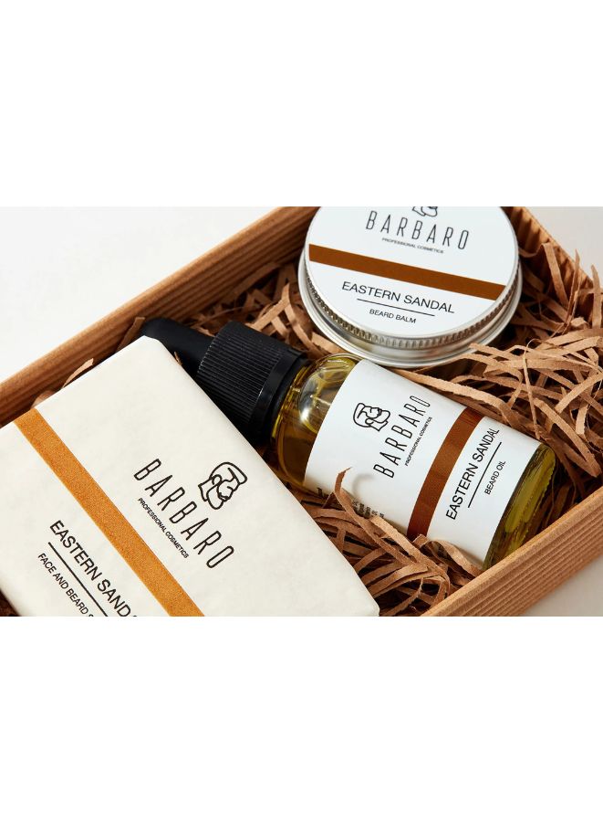 Barbaro grooming products including a bottle, jar, and small container in a wooden box on a white background.