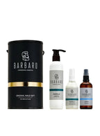 Barbaro grooming products including a black cylindrical container and three bottles on a white background