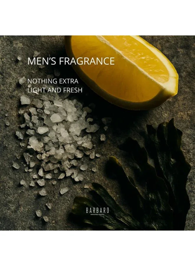 Men's fragrance advertisement with lemon, salt, and dark leaf on a textured surface.