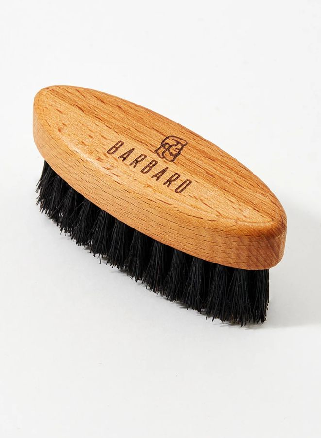 Wooden brush with black bristles on a white background, branded 'Barbaro'.