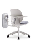 back view of a grey training chair with white writing pad