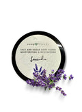 Lavender salt and sugar body scrub with lavender flowers on a white background