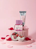 Skincare products including a tube, jar, and small containers on a pink platform with rose petals.