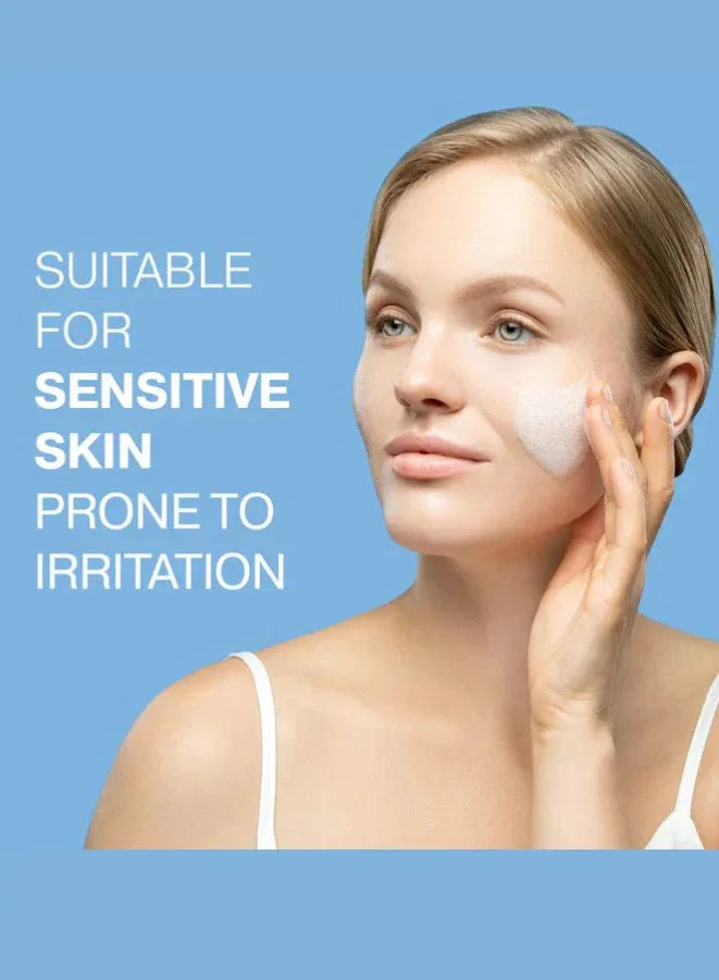 Woman applying cream to her face with a blue background and text indicating suitability for sensitive skin.