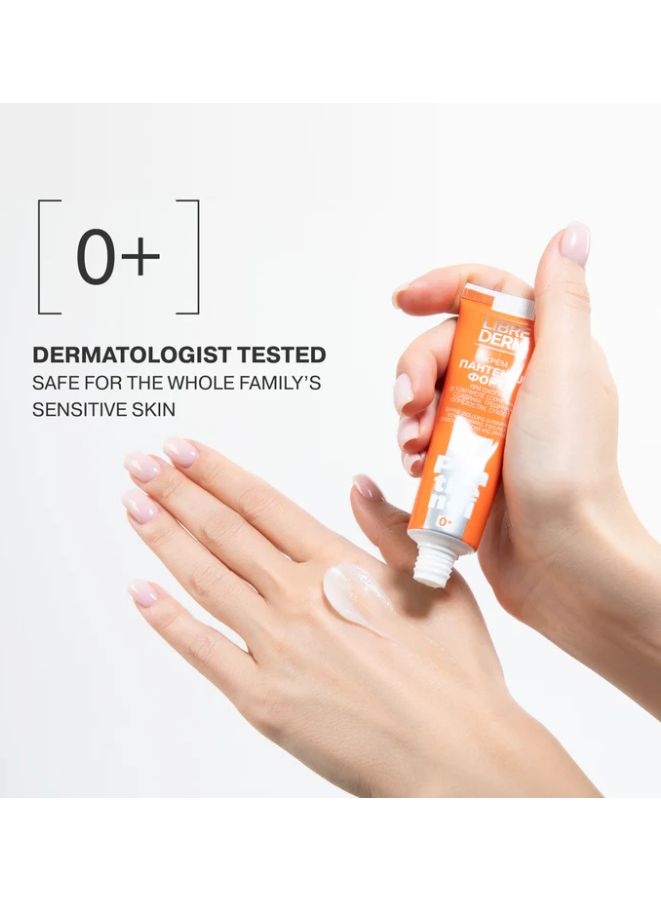 Hand holding a tube of Librederm cream with a white background