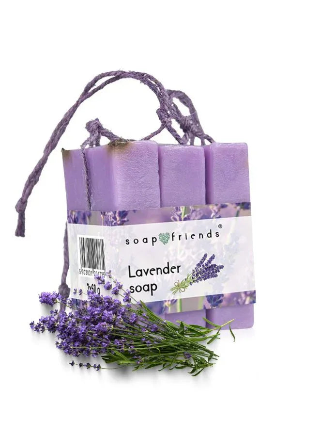 Three lavender-colored soap bars tied with a string, labeled as Lavender Soap, with fresh lavender flowers next to them.