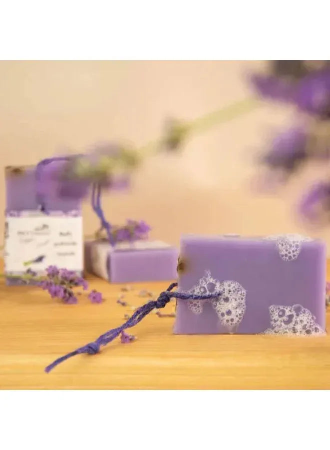 lavender soap bar with a string with little foam on it