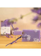 lavender soap bar with a string with little foam on it