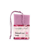 Bar of soap with a pink packaging featuring floral designs and 'soap friends' branding on a white background.