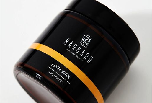 Barbaro hair wax container with black and orange design on a white background