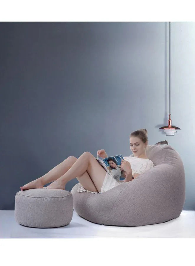 person sitting on LUCKYSAC Classic Bean Bag with foot stool grey