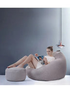 person sitting on LUCKYSAC Classic Bean Bag with foot stool grey